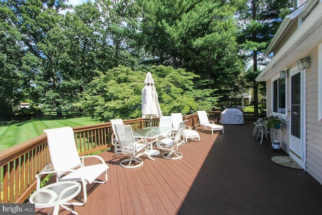 11409 Flints Grove Ln, North Potomac, MD 20878 - deck featuring outdoor dining area and view of wooded area