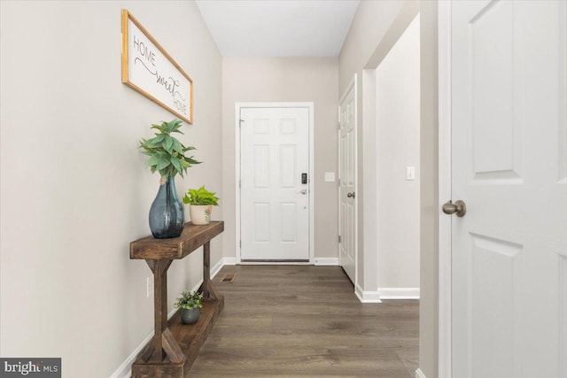 890 Shadows Dr, Front Royal, VA 22630 - doorway to outside with dark wood-type flooring and baseboards