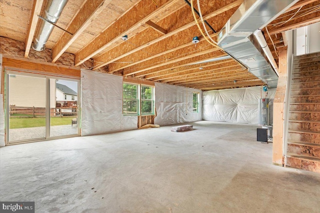 890 Shadows Dr, Front Royal, VA 22630 - miscellaneous room featuring concrete flooring, electric water heater, and stairway