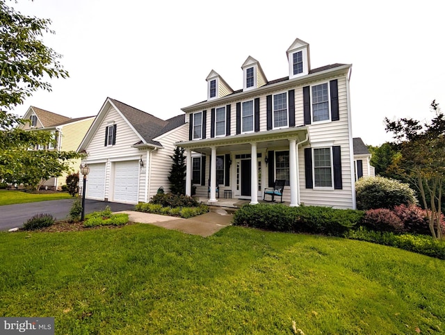 2304 Kings Forest Trl, Mount Airy, MD 21771 - colonial-style house with a porch, driveway, a front lawn, and an attached garage