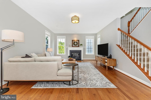 2304 Kings Forest Trl, Mount Airy, MD 21771 - living area with stairway, wood finished floors, and a fireplace with flush hearth