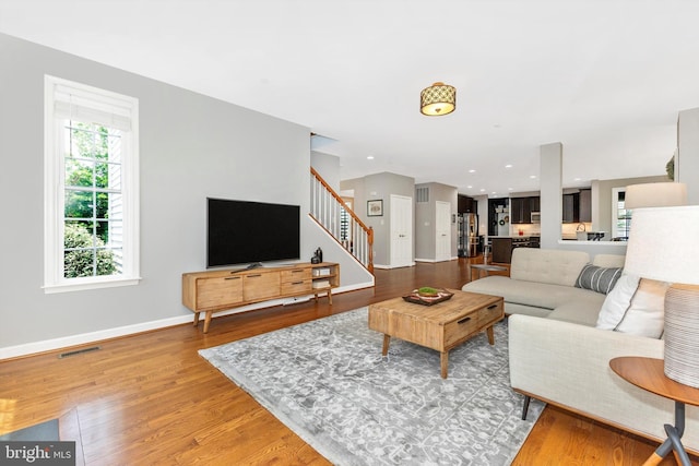 2304 Kings Forest Trl, Mount Airy, MD 21771 - living room featuring stairway and wood finished floors