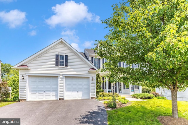 2304 Kings Forest Trl, Mount Airy, MD 21771 - view of front of property with asphalt driveway, a garage, and a front yard