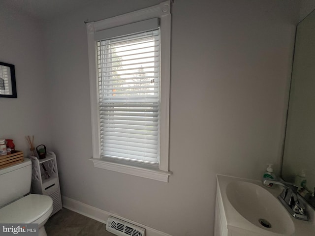 713 Juniper St, Quakertown, PA 18951 - bathroom featuring toilet, vanity, baseboards, and tile patterned flooring