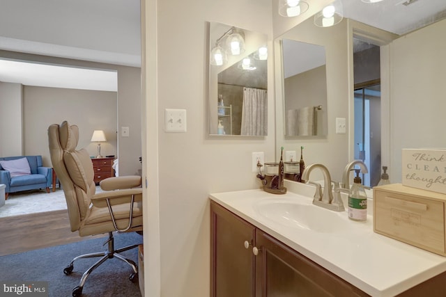 3713 S George Mason Dr Unit 713, Falls Church, VA 22041 - bathroom featuring vanity, wood finished floors, and a shower with curtain