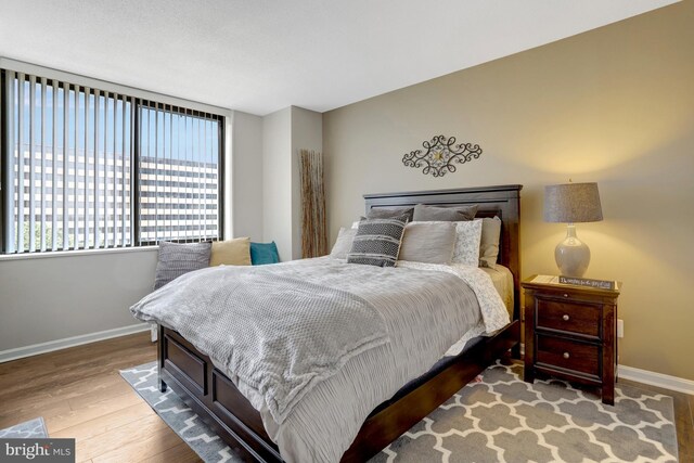 3713 S George Mason Dr Unit 713, Falls Church, VA 22041 - bedroom with baseboards and wood finished floors