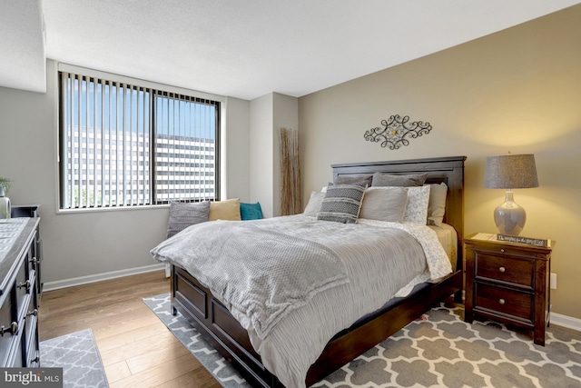 3713 S George Mason Dr Unit 713, Falls Church, VA 22041 - bedroom with light wood finished floors and baseboards