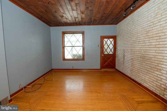 4225 Tackawanna St, Philadelphia, PA 19124 - empty room with baseboards, crown molding, wooden ceiling, wood finished floors, and track lighting