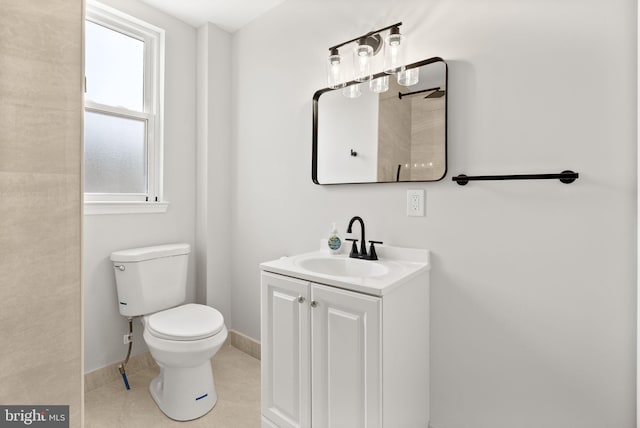 5021 Loretto Ave, Philadelphia, PA 19124 - bathroom with vanity, baseboards, toilet, and tile patterned floors