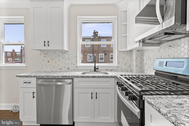 5021 Loretto Ave, Philadelphia, PA 19124 - kitchen featuring stainless steel appliances, a sink, range hood, and white cabinetry