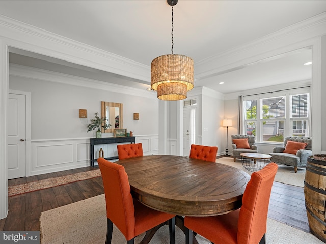 104 Barrister St, Stephenson, VA 22656 - dining area with hardwood / wood-style floors, a chandelier, ornamental molding, a wainscoted wall, and a decorative wall