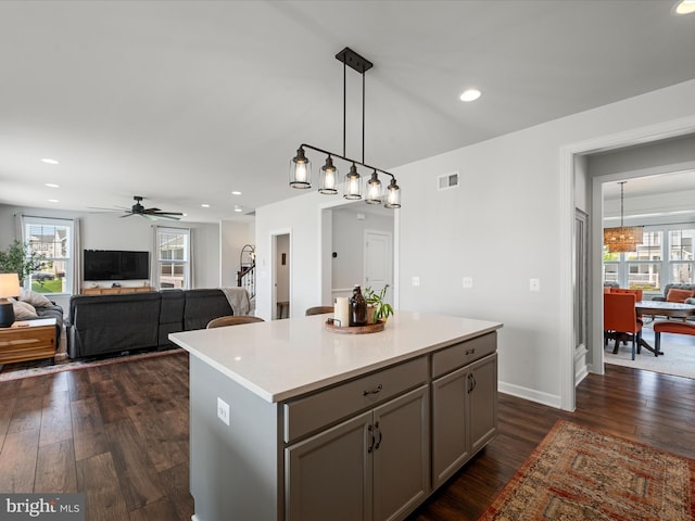 104 Barrister St, Stephenson, VA 22656 - kitchen with gray cabinetry, a center island, light countertops, dark wood-style floors, and recessed lighting