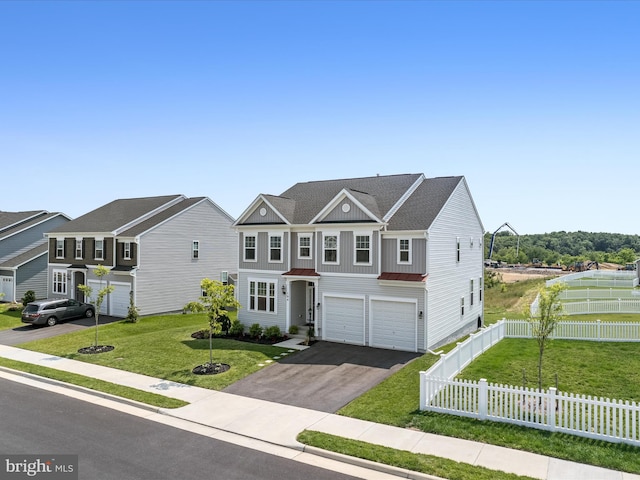 104 Barrister St, Stephenson, VA 22656 - view of property with board and batten siding, asphalt driveway, an attached garage, metal roof, and a standing seam roof