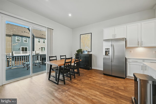1763 Hickory Woods Rd, Dumfries, VA 22026 - dining area with light wood-type flooring and recessed lighting