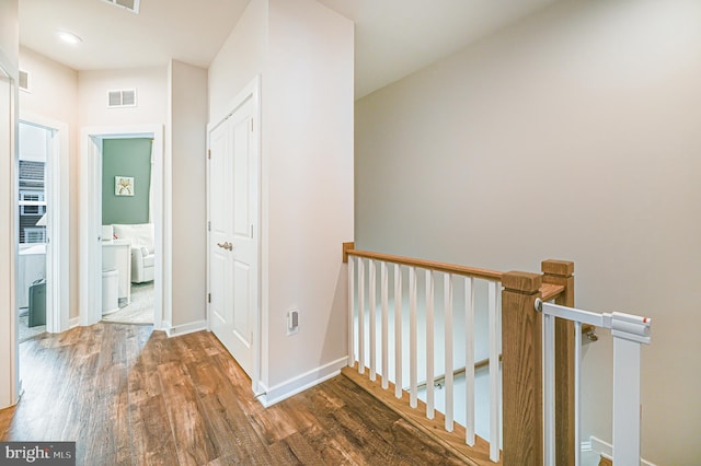 1763 Hickory Woods Rd, Dumfries, VA 22026 - hallway featuring an upstairs landing and wood finished floors