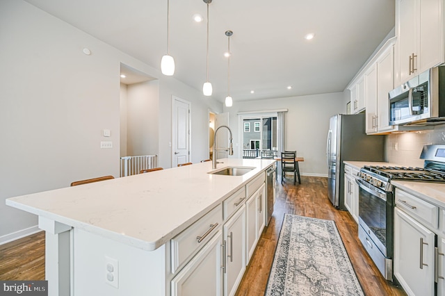 1763 Hickory Woods Rd, Dumfries, VA 22026 - kitchen featuring stainless steel appliances, a center island with sink, dark wood-style floors, white cabinets, and recessed lighting
