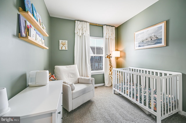1763 Hickory Woods Rd, Dumfries, VA 22026 - carpeted bedroom featuring a crib and baseboards
