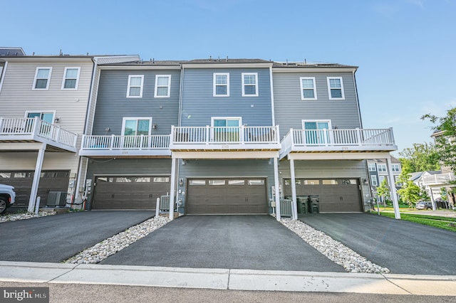 1763 Hickory Woods Rd, Dumfries, VA 22026 - back of property with driveway and a garage