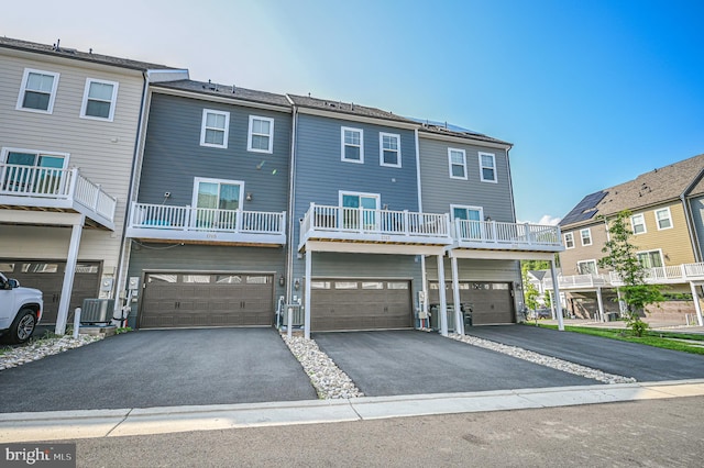 1763 Hickory Woods Rd, Dumfries, VA 22026 - back of house with driveway and an attached garage