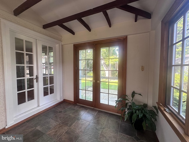 607 Harper Ave, Drexel Hill, PA 19026 - doorway featuring french doors, beamed ceiling, plenty of natural light, dark stone finish flooring, and baseboards