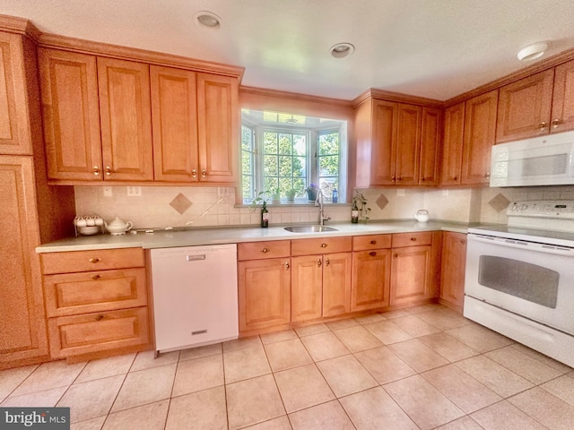 607 Harper Ave, Drexel Hill, PA 19026 - kitchen with white appliances, a sink, backsplash, light countertops, and brown cabinets