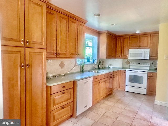 607 Harper Ave, Drexel Hill, PA 19026 - kitchen with white appliances, a sink, light countertops, and tasteful backsplash