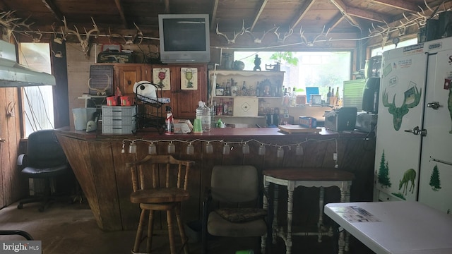 16002 Letcher Rd, Brandywine, MD 20613 - indoor dry bar featuring healthy amount of natural light, vaulted ceiling, and unfinished concrete flooring