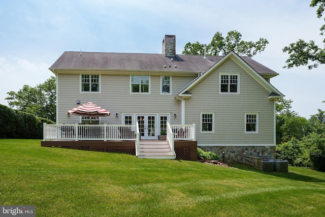 58 Haas Rd, Basking Ridge, NJ 07920 - back of property with a deck, a chimney, a lawn, and french doors
