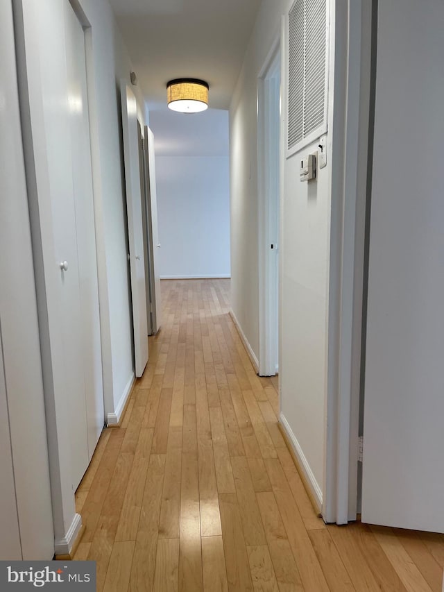 700 7th St SW Unit 403, Washington, DC 20024 - hall featuring light wood-type flooring and baseboards