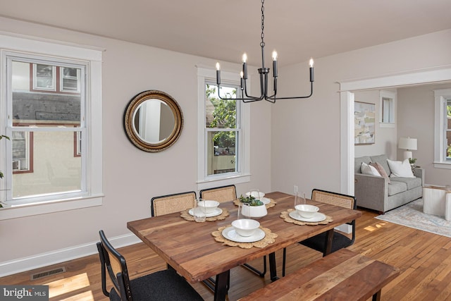 2912 Bauernwood Ave, Baltimore, MD 21234 - dining area with a chandelier, hardwood / wood-style flooring, and baseboards