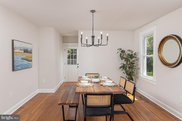 2912 Bauernwood Ave, Baltimore, MD 21234 - dining area featuring a chandelier, hardwood / wood-style flooring, baseboards, and healthy amount of natural light