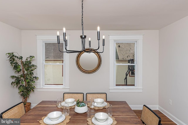 2912 Bauernwood Ave, Baltimore, MD 21234 - dining space with baseboards, wood finished floors, and a chandelier