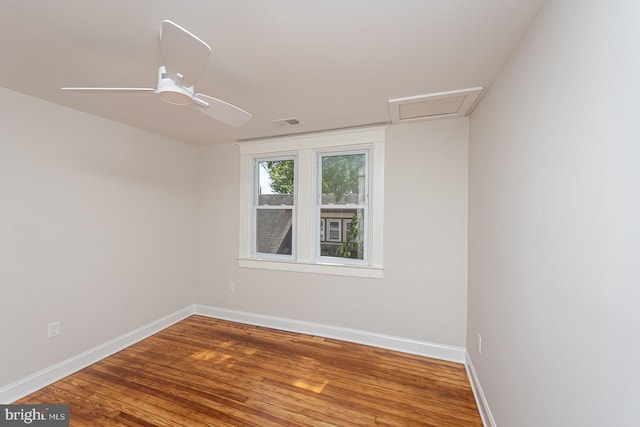 2912 Bauernwood Ave, Baltimore, MD 21234 - empty room featuring wood finished floors, baseboards, and attic access