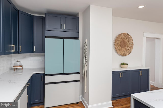 2912 Bauernwood Ave, Baltimore, MD 21234 - kitchen with built in refrigerator, blue cabinets, wood finished floors, decorative backsplash, and recessed lighting