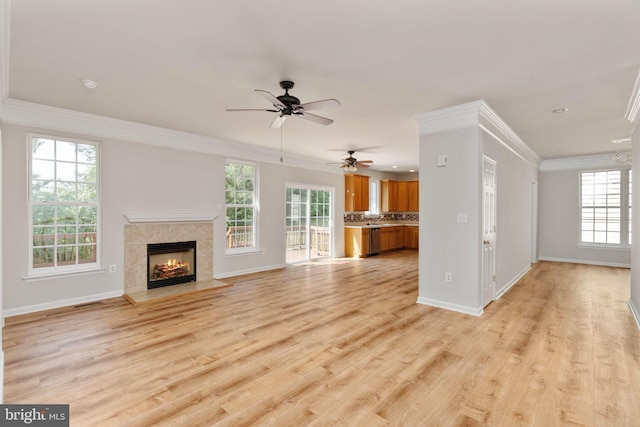 35510 Somerset Ridge Rd, Locust Grove, VA 22508 - unfurnished living room with plenty of natural light, crown molding, light wood-type flooring, ceiling fan, and a premium fireplace