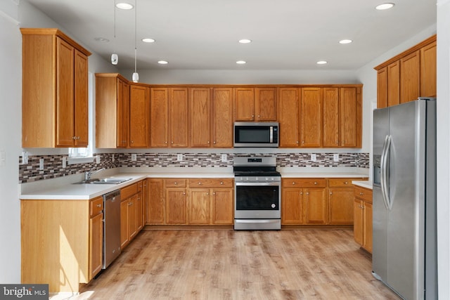 35510 Somerset Ridge Rd, Locust Grove, VA 22508 - kitchen featuring appliances with stainless steel finishes, light countertops, decorative backsplash, light wood finished floors, and recessed lighting