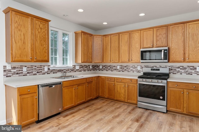 35510 Somerset Ridge Rd, Locust Grove, VA 22508 - kitchen featuring appliances with stainless steel finishes, light countertops, backsplash, light wood finished floors, and recessed lighting