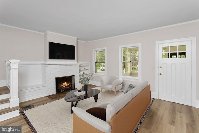 26 Jefferson Rd, Princeton, NJ 08540 - living room featuring wood finished floors, a brick fireplace, and ornamental molding