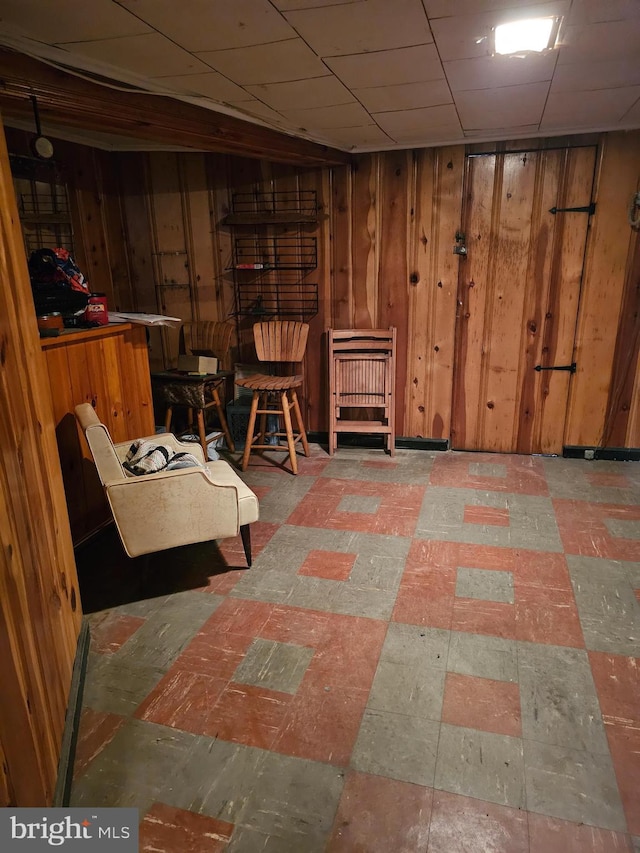 1943 W Sparks St, Philadelphia, PA 19141 - living area featuring tile patterned floors and wood walls