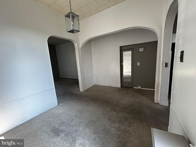 342 S 4th St, Reading, PA 19602 - carpeted spare room with arched walkways and baseboard heating