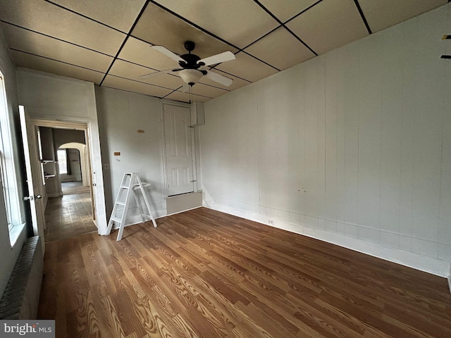 342 S 4th St, Reading, PA 19602 - unfurnished room featuring arched walkways, wood finished floors, a ceiling fan, and baseboards