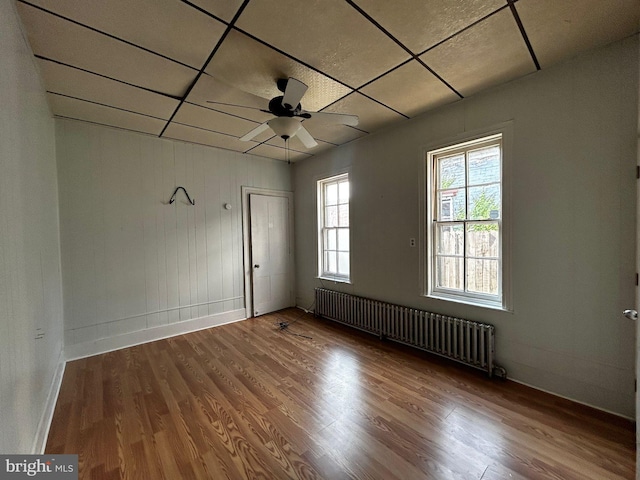 342 S 4th St, Reading, PA 19602 - spare room featuring radiator, baseboards, wood finished floors, and a drop ceiling
