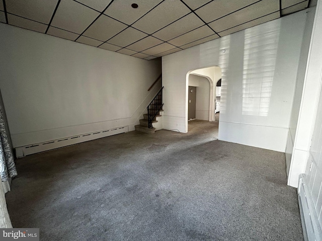342 S 4th St, Reading, PA 19602 - unfurnished living room with arched walkways, baseboard heating, stairway, carpet, and a paneled ceiling