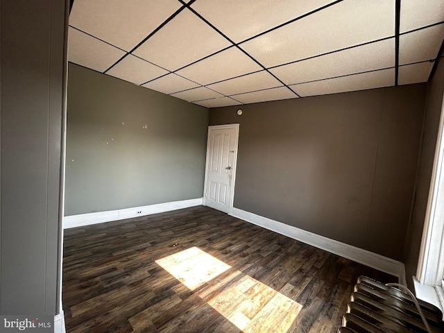 342 S 4th St, Reading, PA 19602 - spare room featuring a paneled ceiling, baseboards, and wood finished floors