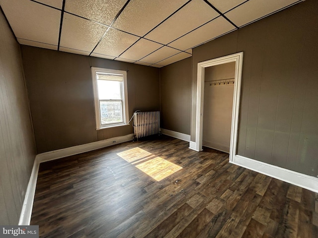 342 S 4th St, Reading, PA 19602 - unfurnished bedroom featuring dark wood-style flooring, a drop ceiling, and baseboards