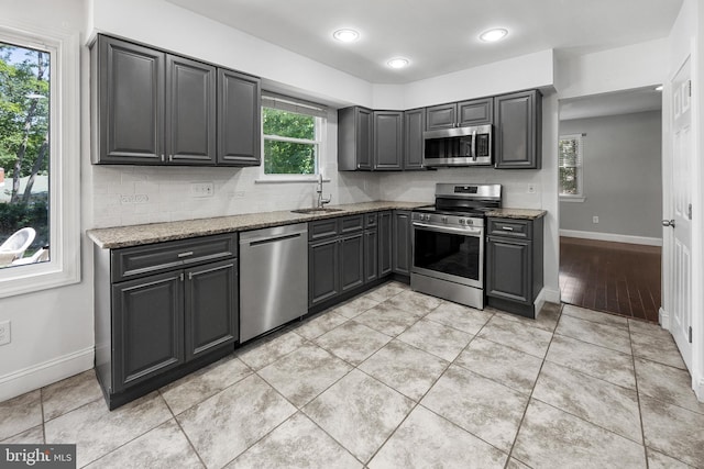 19 Hollybrook Way, Voorhees, NJ 08043 - kitchen featuring stainless steel appliances, light stone counters, gray cabinets, decorative backsplash, and recessed lighting