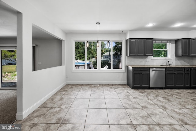 19 Hollybrook Way, Voorhees, NJ 08043 - kitchen with dishwasher, light stone countertops, light tile patterned floors, and decorative backsplash