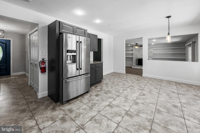 19 Hollybrook Way, Voorhees, NJ 08043 - kitchen with stainless steel refrigerator with ice dispenser, light tile patterned floors, built in shelves, a stone fireplace, and ceiling fan