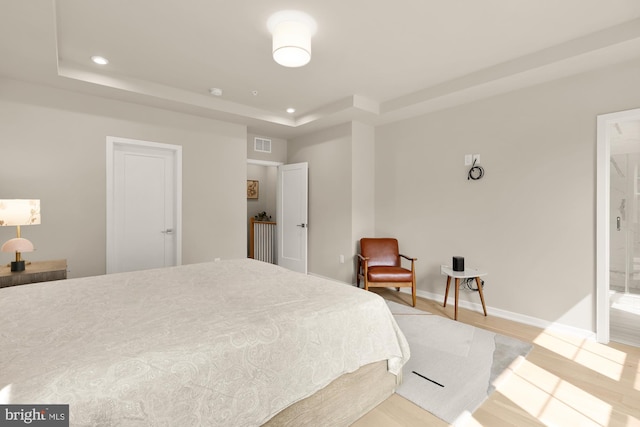 7458 Backett Wood Ter Unit 401, Mclean, VA 22102 - bedroom featuring a raised ceiling, light wood-type flooring, recessed lighting, and baseboards