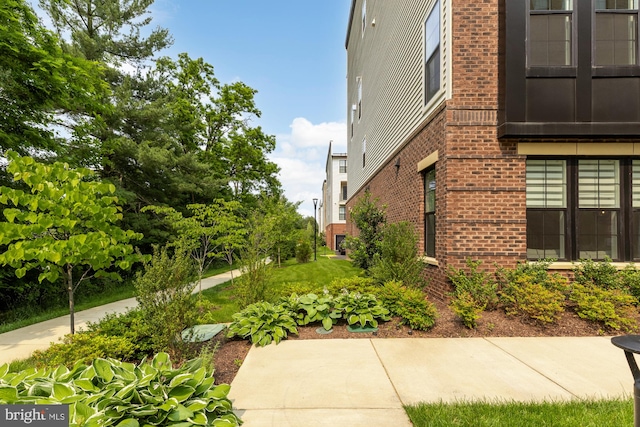 7458 Backett Wood Ter Unit 401, Mclean, VA 22102 - view of property exterior featuring brick siding